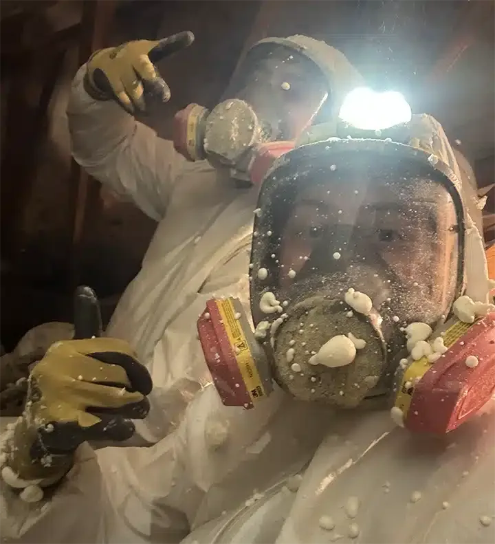 HVAC techs working with spray foam insulation