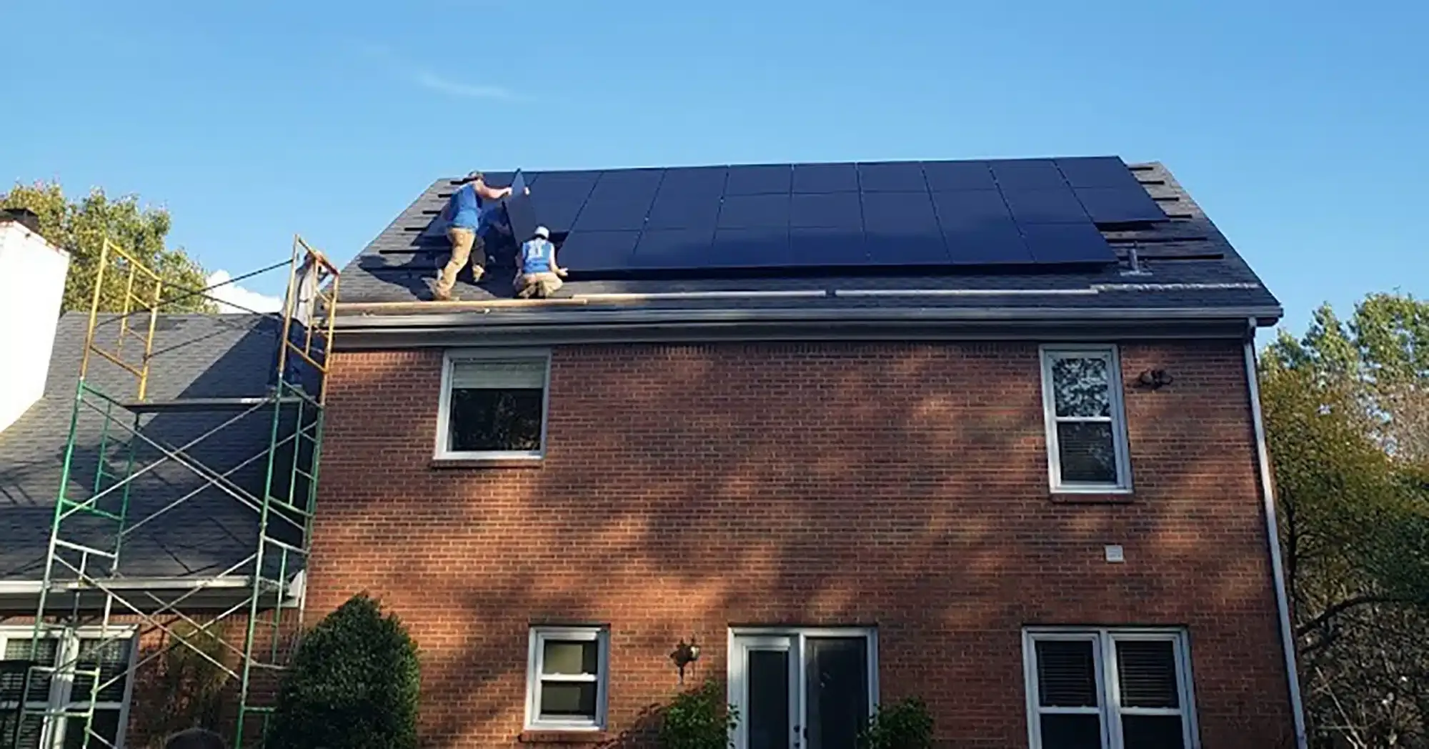 Techs installing solar panels on roof in Lexington, KY.