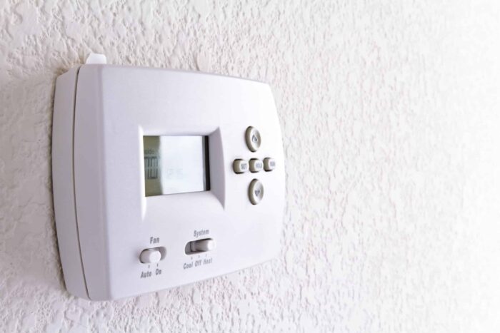 digital thermostat on white wall