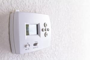digital thermostat on white wall