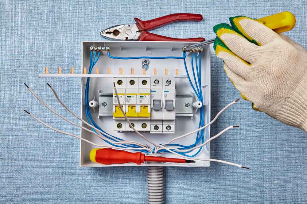 An Electrician Conducting an Electrical Wiring Repair