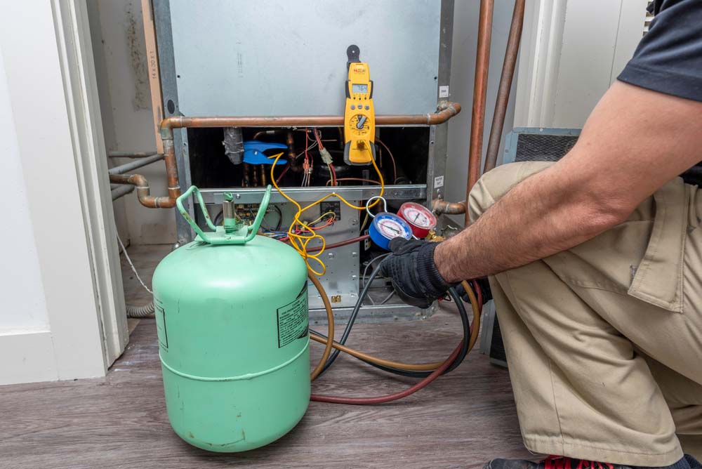 technician charging a heat pump with refrigerant Lexington, KY