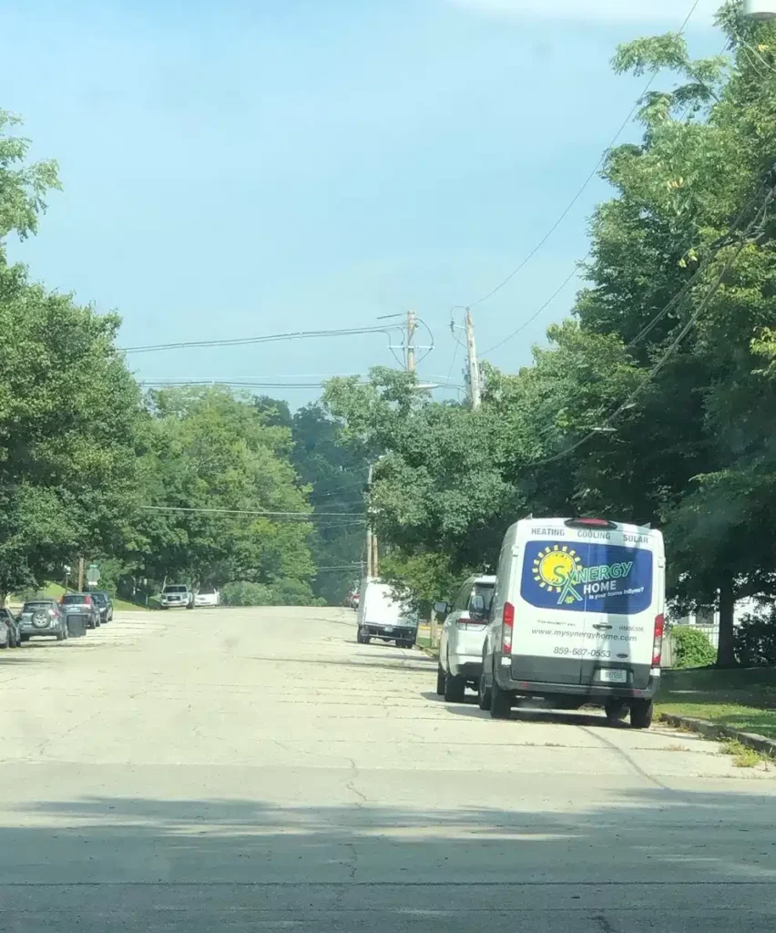 Back of Synergy van parked on street in Lexington, KY.