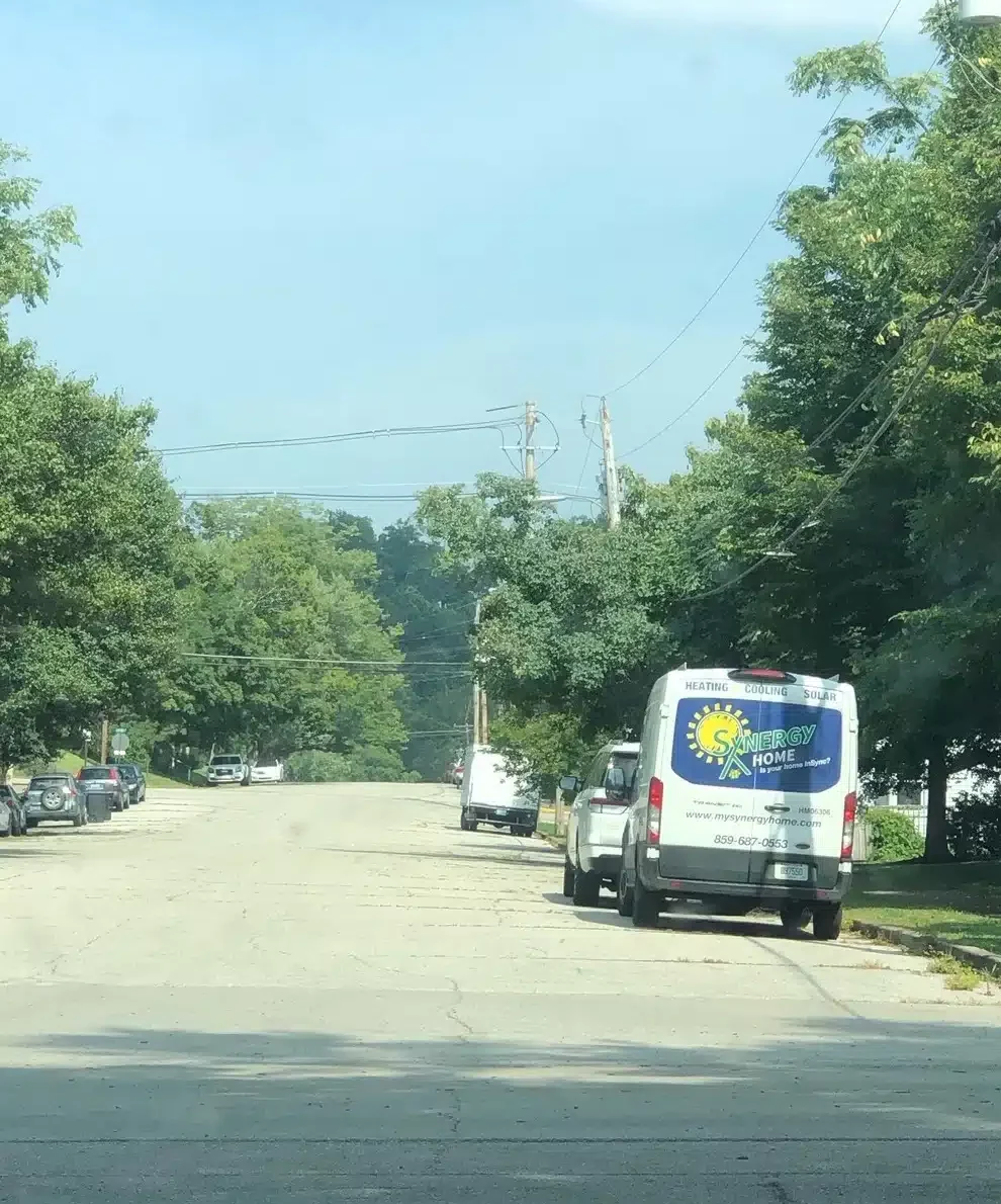 Back of Synergy van parked on street in Lexington, KY.
