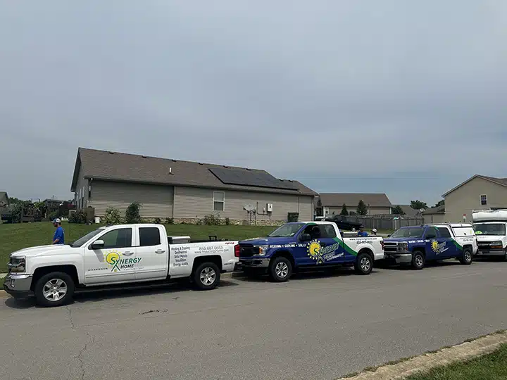 New solar panels on residential home in Lexington, KY with Synergy trucks out front.