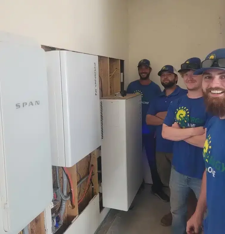 Synergy Home team in front of electric panels in Lexington, KY.