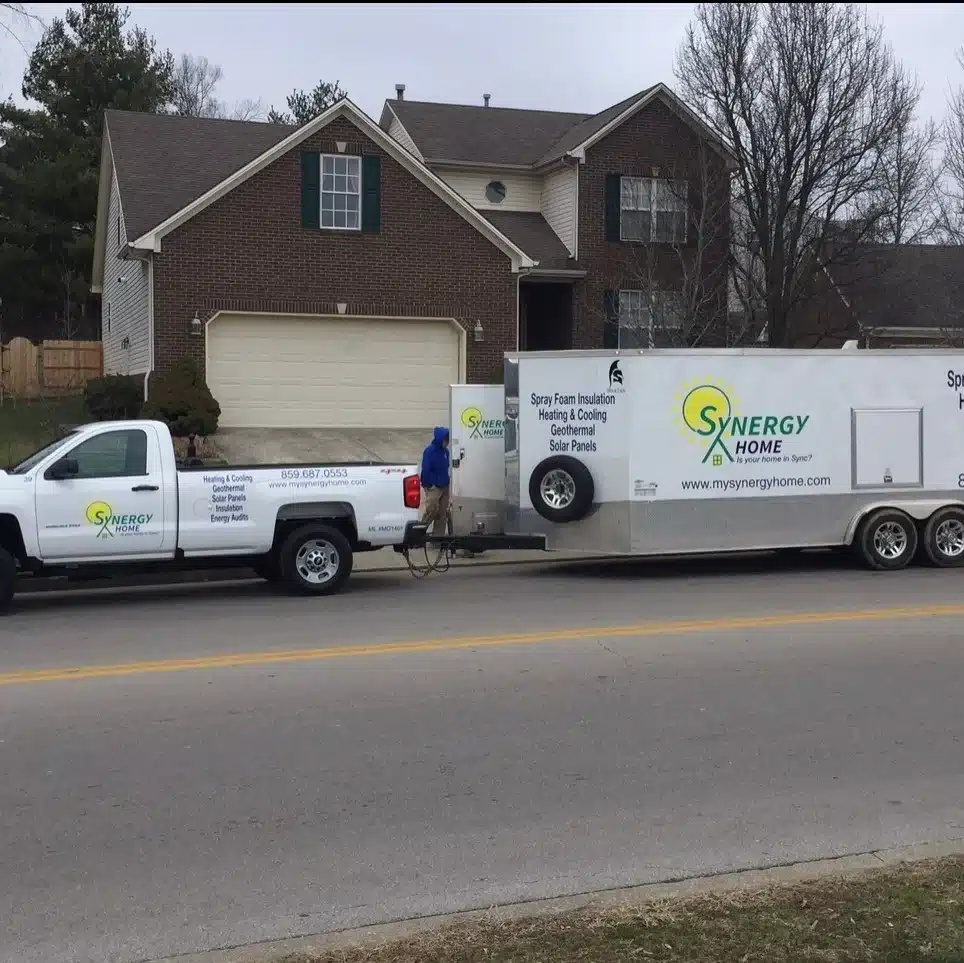Synergy Home truck and trailer outside of residential home in Lexington, KY.
